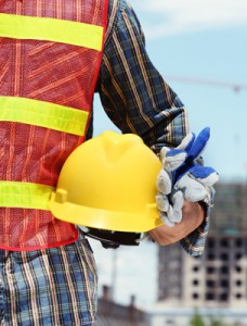 man holding yellow helmet